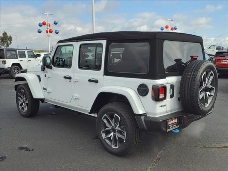 2024 Jeep Wrangler Sport S 4xe in a Bright White Clear Coat exterior color and Blackinterior. Perris Valley Auto Center 951-657-6100 perrisvalleyautocenter.com 