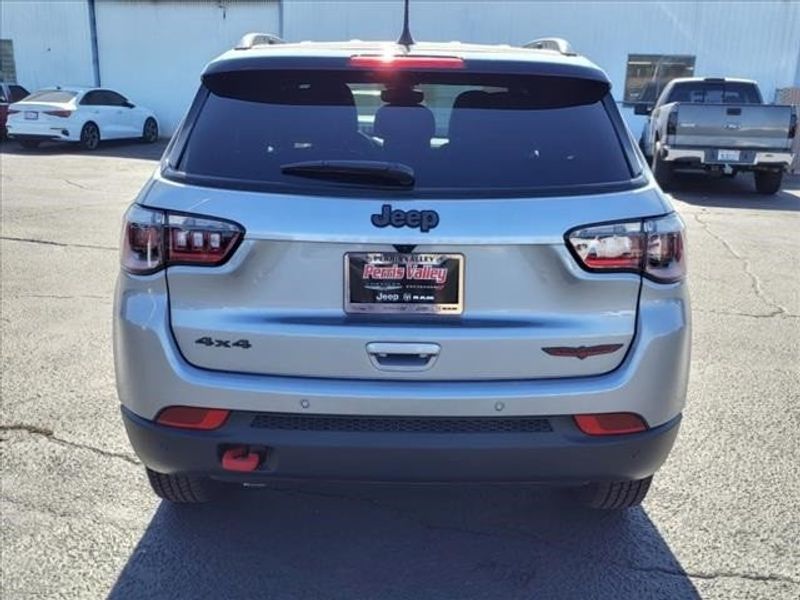 2024 Jeep Compass Trailhawk in a Billet Silver Metallic Clear Coat exterior color and Ruby Red/Blackinterior. Perris Valley Auto Center 951-657-6100 perrisvalleyautocenter.com 