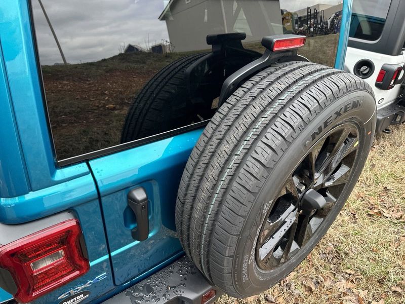 2024 Jeep Wrangler 4-door Sahara 4xe in a Bikini Pearl Coat exterior color. Gupton Motors Inc 615-384-2886 guptonmotors.com 