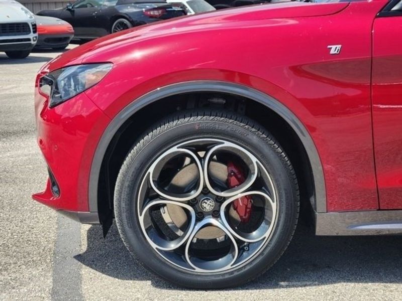 2024 Alfa Romeo Stelvio Ti in a Alfa Rosso exterior color and Blackinterior. Northside Imports Houston 281-475-4549 northsideimportshouston.com 