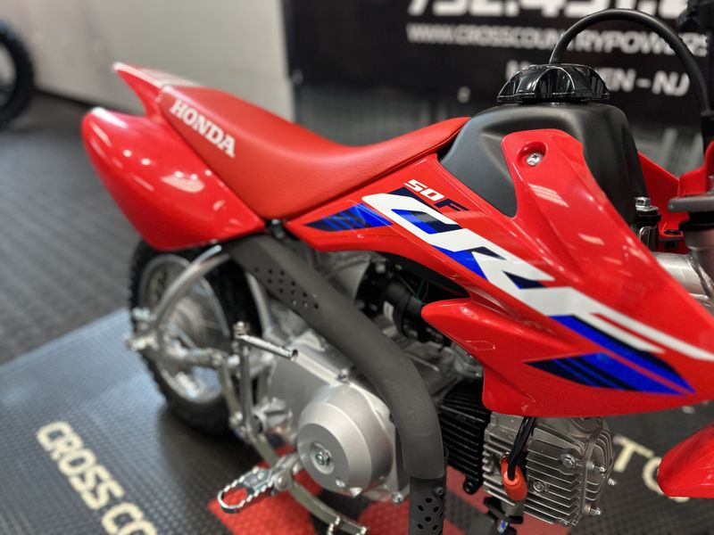 2024 Honda CRF50F in a RED exterior color. Cross Country Powersports 732-491-2900 crosscountrypowersports.com 