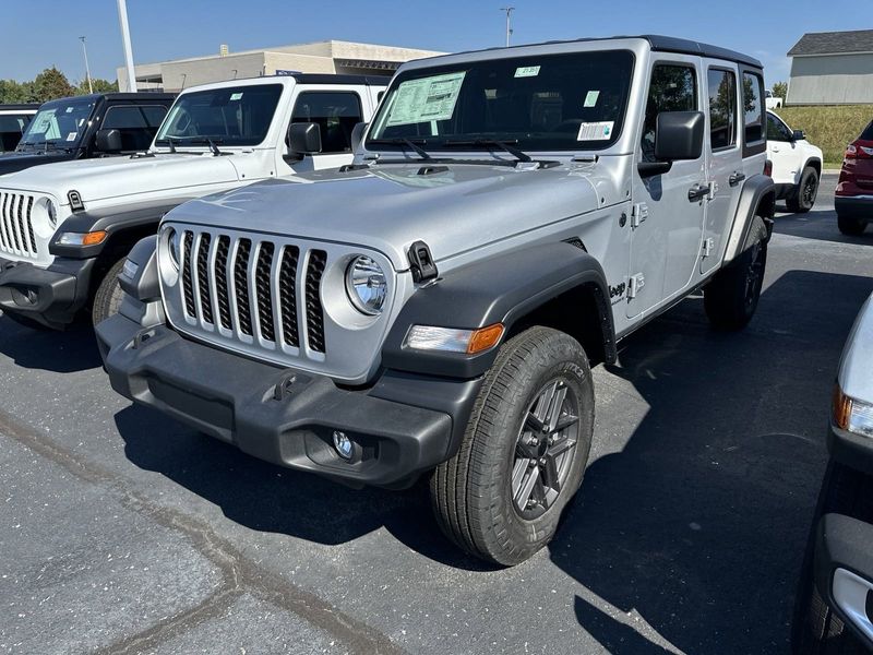 2024 Jeep Wrangler 4-door Sport S in a Silver Zynith Clear Coat exterior color and Blackinterior. CDJR of Anytown 949-555-4321 pixelmotiondemo.com 