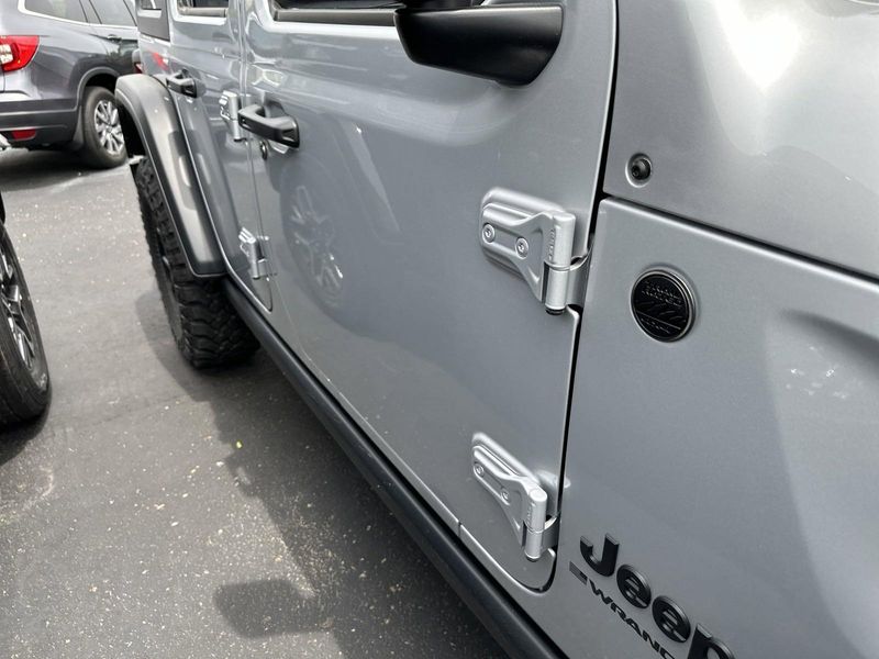 2024 Jeep Wrangler 4-door Willys in a Silver Zynith Clear Coat exterior color and Blackinterior. Gupton Motors Inc 615-384-2886 guptonmotors.com 