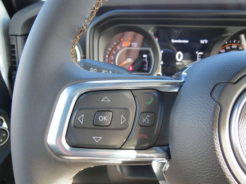 2024 Jeep Wrangler 4-door Sahara in a Bright White Clear Coat exterior color and Blackinterior. Militello Motors ​507-200-4344 militellomotors.net 