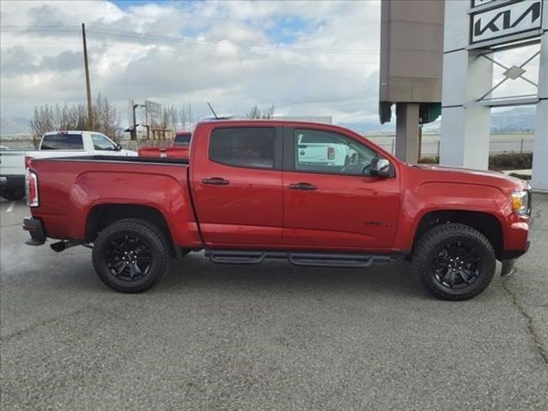 2021 GMC Canyon AT4 w/Cloth in a Cayenne Red Tint Coat exterior color and Jet Black/Kalahariinterior. Perris Valley Auto Center 951-657-6100 perrisvalleyautocenter.com 