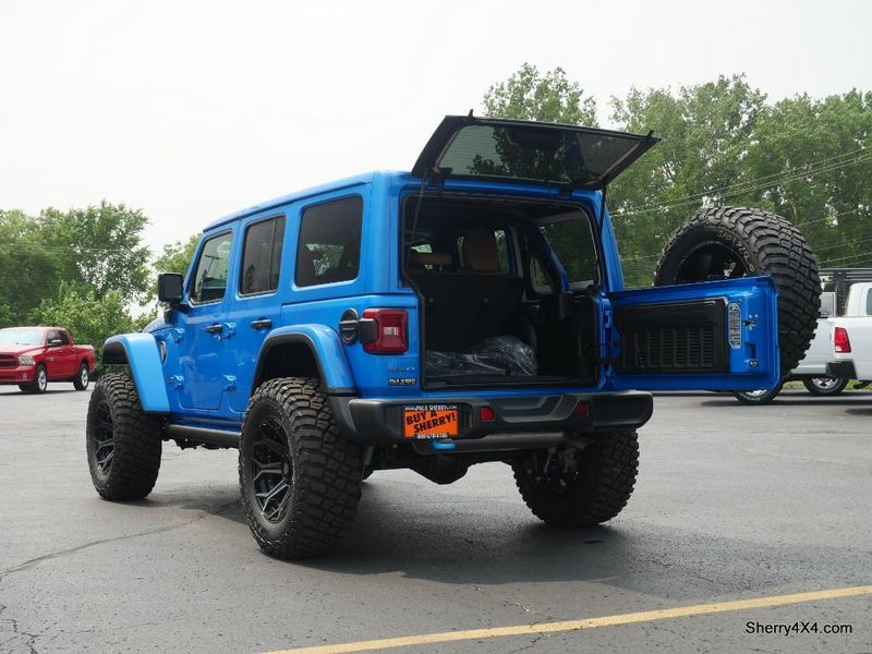 2023 Jeep Wrangler Rubicon 4xe in a Hydro Blue Pearl Coat exterior color and Black/Dark Saddleinterior. Paul Sherry Chrysler Dodge Jeep RAM (937) 749-7061 sherrychrysler.net 