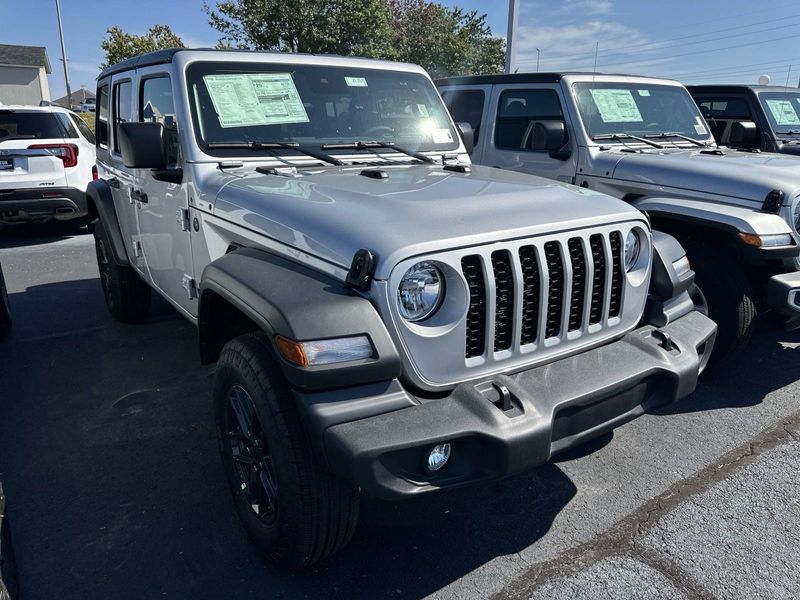 2024 Jeep Wrangler 4-door Sport S in a Silver Zynith Clear Coat exterior color and Blackinterior. CDJR of Anytown 949-555-4321 pixelmotiondemo.com 