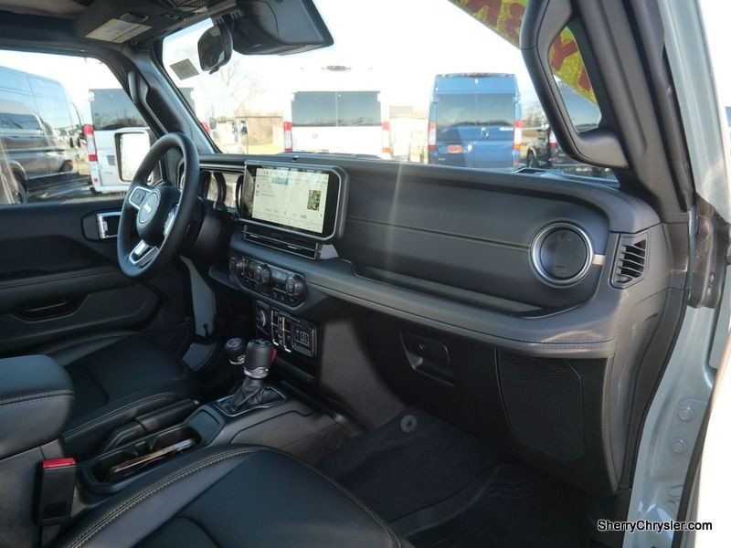 2024 Jeep Wrangler 4-door Sahara 4xe in a Earl Clear Coat exterior color and Blackinterior. Paul Sherry Chrysler Dodge Jeep RAM (937) 749-7061 sherrychrysler.net 