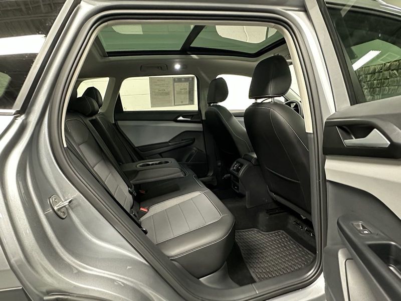 2023 Volkswagen Taos SE w/Sunroof & Black Wheel Pkg in a Pyrite Silver Metallic exterior color and Black Heated Seatsinterior. Schmelz Countryside Alfa Romeo and Fiat (651) 968-0556 schmelzfiat.com 