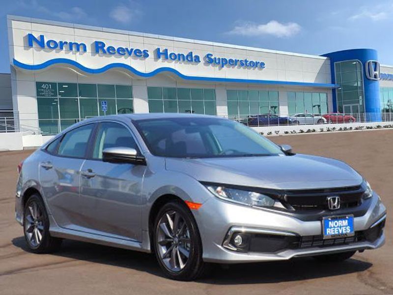 2020 Honda Civic Sedan EX in a Lunar Silver Metallic exterior color and Blackinterior. BEACH BLVD OF CARS beachblvdofcars.com 