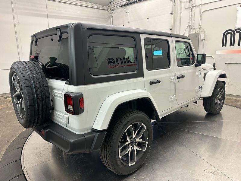 2024 Jeep Wrangler 4-door Sport S 4xe in a Bright White Clear Coat exterior color and Blackinterior. Marina Chrysler Dodge Jeep RAM (855) 616-8084 marinadodgeny.com 