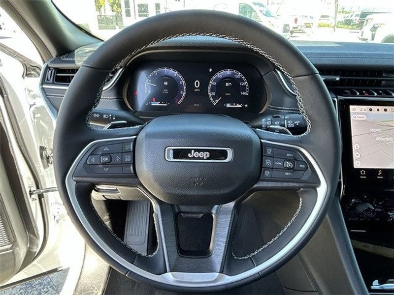 2024 Jeep Grand Cherokee Limited 4x4 in a Bright White Clear Coat exterior color. McPeek