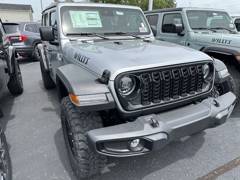 2024 Jeep Wrangler 4-door Willys in a Silver Zynith Clear Coat exterior color and Blackinterior. CDJR of Anytown 949-555-4321 pixelmotiondemo.com 