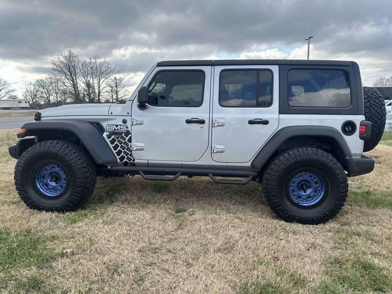 2024 Jeep Wrangler 4-door Sport S in a Silver Zynith Clear Coat exterior color and Blackinterior. Gupton Motors Inc 615-384-2886 guptonmotors.com 