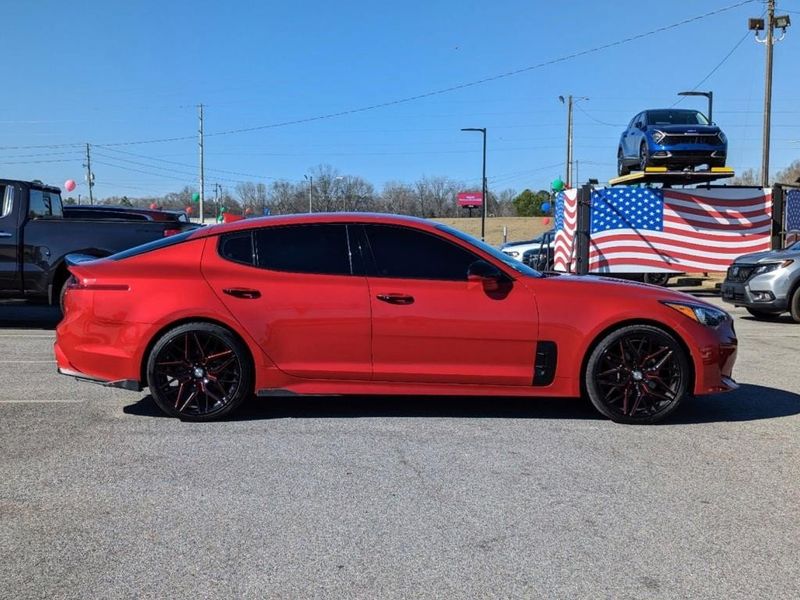 2019 Kia Stinger Base in a HiChroma Red exterior color and Blackinterior. Johnson Dodge 601-693-6343 pixelmotiondemo.com 