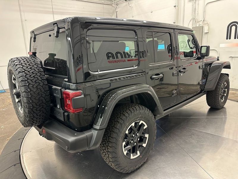 2024 Jeep Wrangler 4-door Rubicon X 4xe in a Black Clear Coat exterior color and Blackinterior. Marina Auto Group (855) 564-8688 marinaautogroup.com 