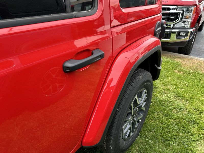 2024 Jeep Wrangler 4-door Sahara in a Firecracker Red Clear Coat exterior color. Gupton Motors Inc 615-384-2886 guptonmotors.com 