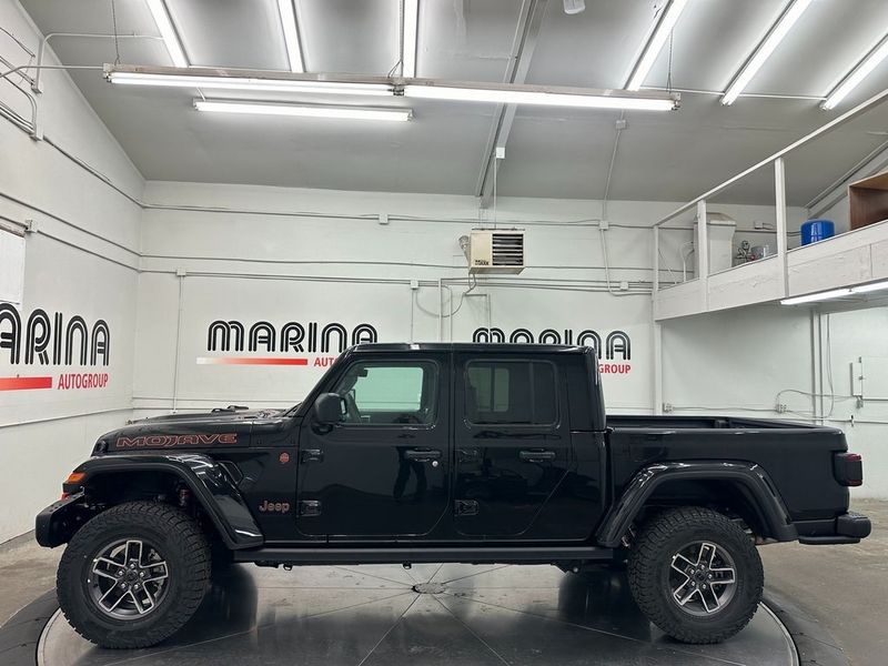 2024 Jeep Gladiator Mojave X 4x4 in a Black Clear Coat exterior color. Marina Auto Group (855) 564-8688 marinaautogroup.com 