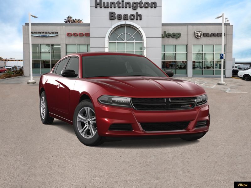 2023 Dodge Charger SXT in a Octane Red Pearl Coat exterior color and Blackinterior. BEACH BLVD OF CARS beachblvdofcars.com 