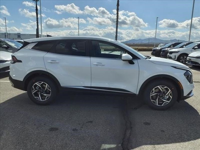 2024 Kia Sportage LX in a Snow White Pearl exterior color and Blackinterior. Perris Valley Auto Center 951-657-6100 perrisvalleyautocenter.com 