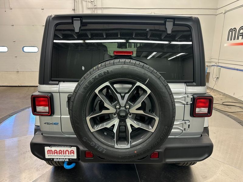 2024 Jeep Wrangler 4-door Sport S 4xe in a Silver Zynith Clear Coat exterior color and Blackinterior. Marina Chrysler Dodge Jeep RAM (855) 616-8084 marinadodgeny.com 