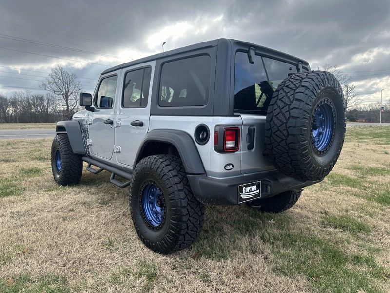 2024 Jeep Wrangler 4-door Sport S in a Silver Zynith Clear Coat exterior color and Blackinterior. Gupton Motors Inc 615-384-2886 guptonmotors.com 