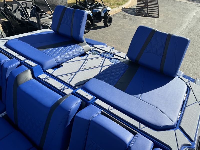 2024 MALIBU WAKESETTER M242  in a BLUE/GRAY/BLACK exterior color. Family PowerSports (877) 886-1997 familypowersports.com 