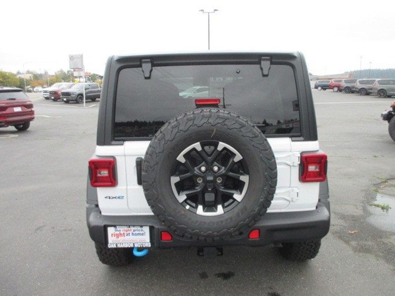 2024 Jeep Wrangler 4-door Rubicon 4xe in a WHITE exterior color and BLACKinterior. Oak Harbor Motors Inc. 360-323-6434 ohmotors.com 