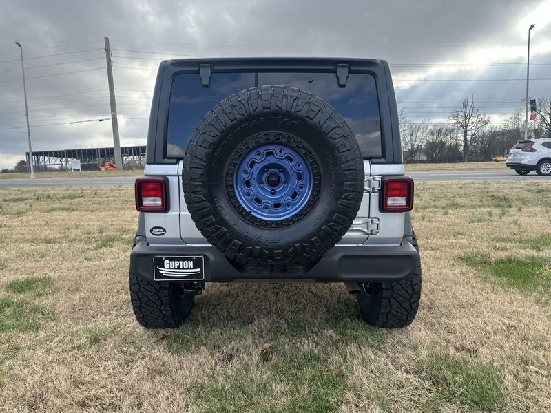 2024 Jeep Wrangler 4-door Sport S in a Silver Zynith Clear Coat exterior color and Blackinterior. Gupton Motors Inc 615-384-2886 guptonmotors.com 