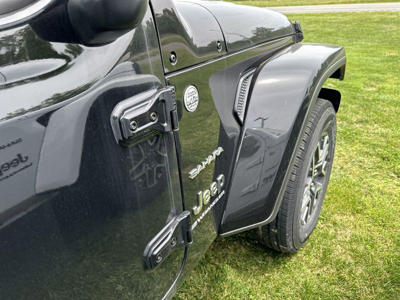 2024 Jeep Wrangler 4-door Sahara in a Black Clear Coat exterior color. Gupton Motors Inc 615-384-2886 guptonmotors.com 