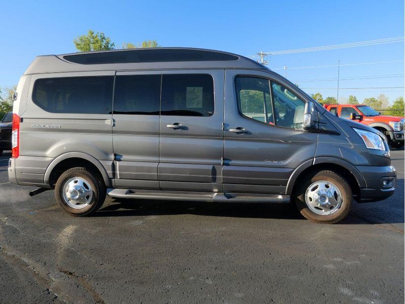 2021 Ford Transit-150 Cargo Van  in a Carbonized Gray Metallic exterior color and Graphiteinterior. Paul Sherry Chrysler Dodge Jeep RAM (937) 749-7061 sherrychrysler.net 