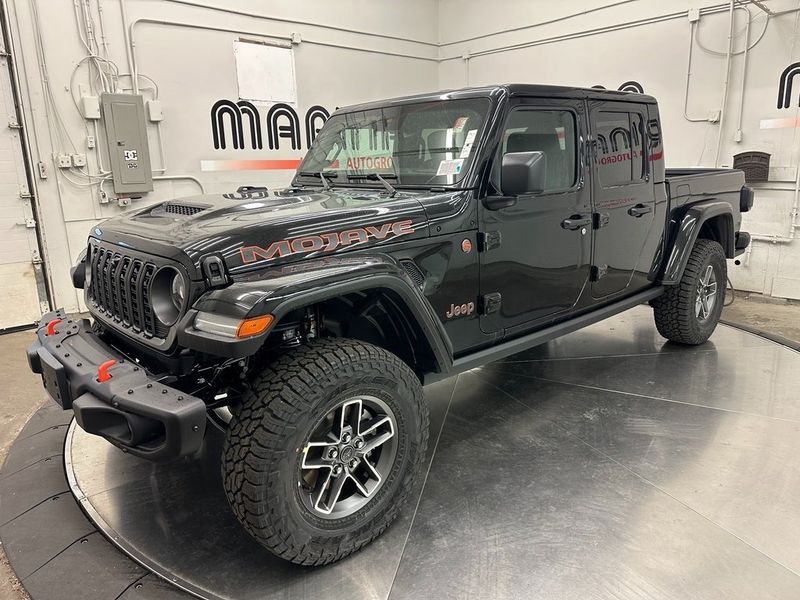 2024 Jeep Gladiator Mojave X 4x4 in a Black Clear Coat exterior color. Marina Chrysler Dodge Jeep RAM (855) 616-8084 marinadodgeny.com 