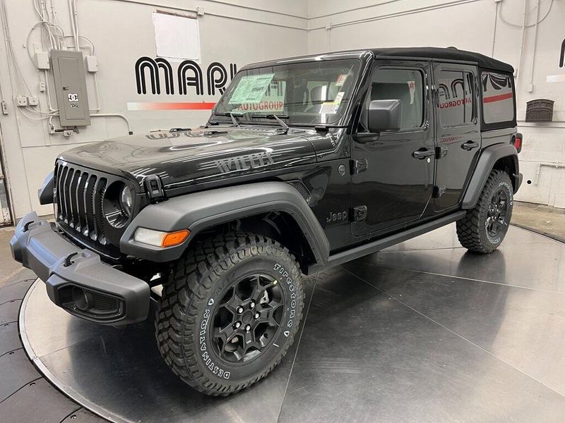 2023 Jeep Wrangler 4-door Willys 4x4 in a Black Clear Coat exterior color and Blackinterior. Marina Chrysler Dodge Jeep RAM (855) 616-8084 marinadodgeny.com 