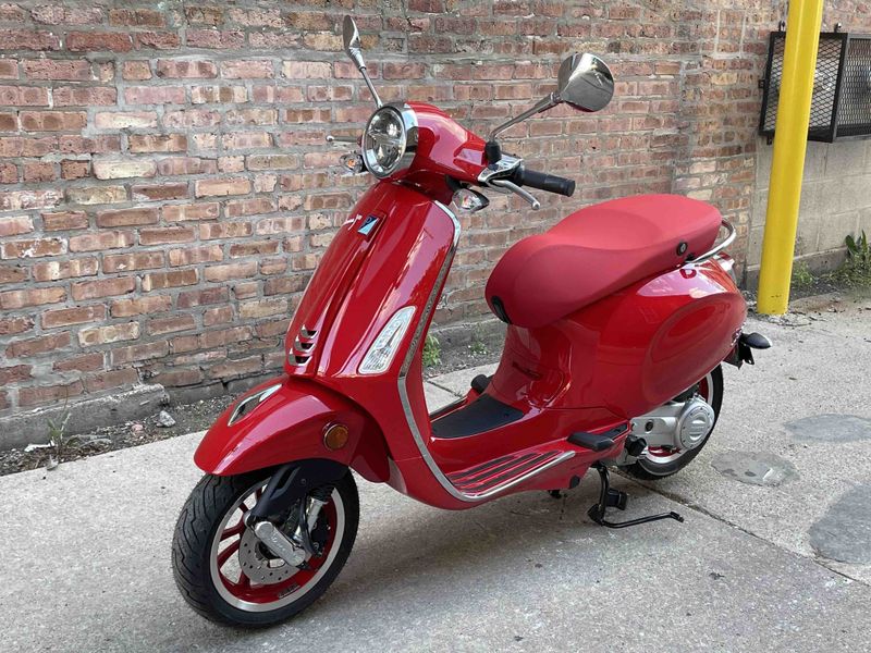 2023 Vespa Primavera 50 (red)   in a red exterior color. Motoworks Chicago 312-738-4269 motoworkschicago.com 