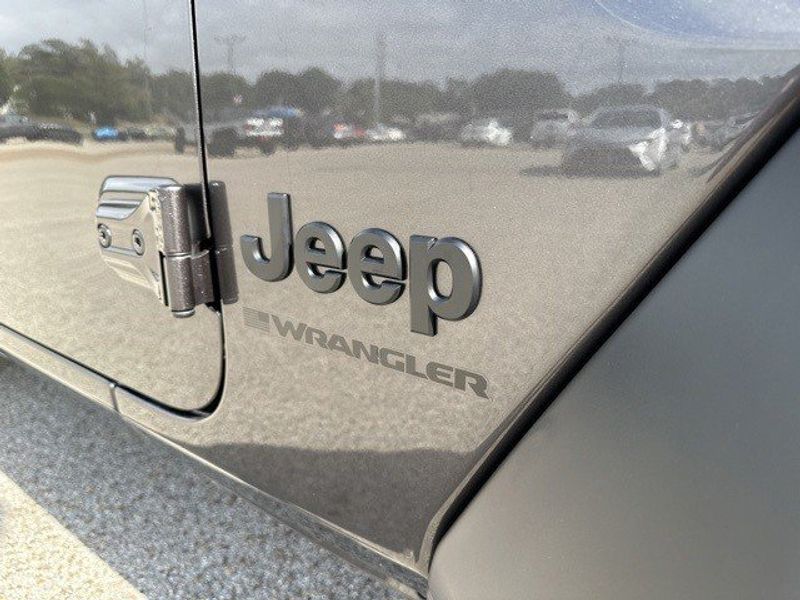 2023 Jeep Wrangler 4-door Sport Altitude 4x4 in a Granite Crystal Metallic Clear Coat exterior color and Blackinterior. Randall Dodge Chrysler Jeep 877-790-6380 randalldodgechryslerjeep.com 