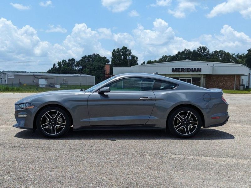 2022 Ford Mustang EcoBoost Premium in a Carbonized Gray Metallic exterior color and Ebonyinterior. Johnson Dodge 601-693-6343 pixelmotiondemo.com 
