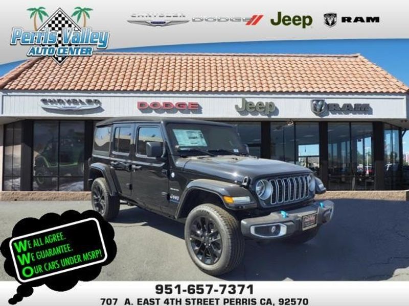 2024 Jeep Wrangler Sahara 4xe in a Black Clear Coat exterior color and Blackinterior. Perris Valley Auto Center 951-657-6100 perrisvalleyautocenter.com 