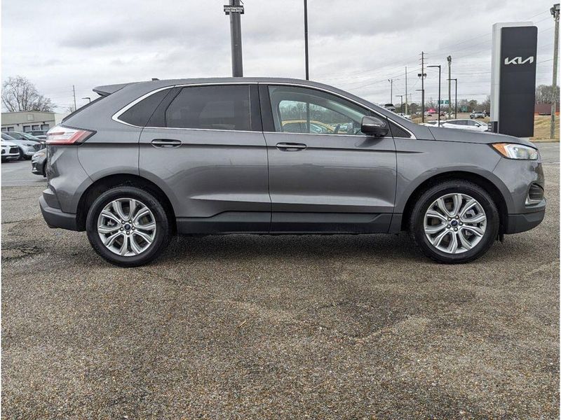 2022 Ford Edge Titanium in a Carbonized Gray Metallic exterior color and Medium Soft Ceramicinterior. Johnson Dodge 601-693-6343 pixelmotiondemo.com 