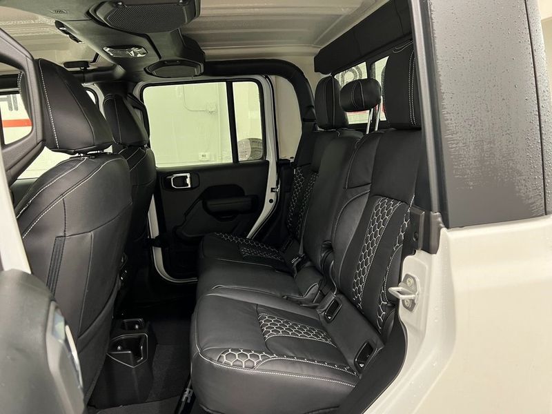 2022 Jeep Gladiator Sport S 4x4 in a Bright White Clear Coat exterior color and Global Black/Steel Grayinterior. Marina Auto Group (855) 564-8688 marinaautogroup.com 