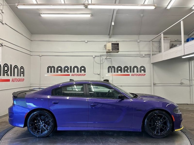 2023 Dodge Charger Scat Pack in a Plum Crazy exterior color. Marina Auto Group (855) 564-8688 marinaautogroup.com 