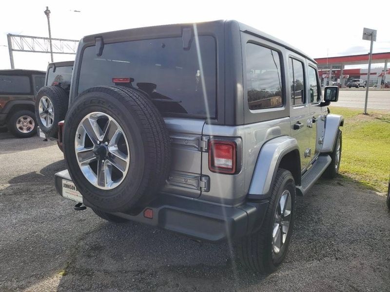 2020 Jeep Wrangler Unlimited Sahara in a Billet Silver Metallic Clear Coat exterior color and Blackinterior. Johnson Dodge 601-693-6343 pixelmotiondemo.com 