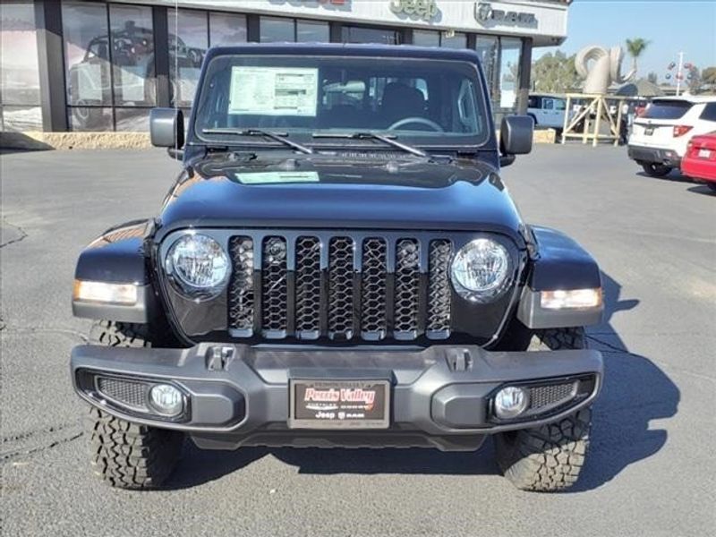2023 Jeep Gladiator Sport in a Black Clear Coat exterior color and Blackinterior. Perris Valley Auto Center 951-657-6100 perrisvalleyautocenter.com 