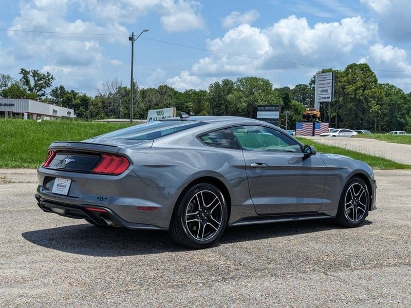 2022 Ford Mustang EcoBoost Premium in a Carbonized Gray Metallic exterior color and Ebonyinterior. Johnson Dodge 601-693-6343 pixelmotiondemo.com 