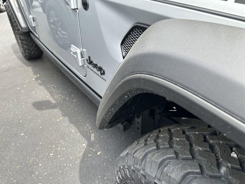 2024 Jeep Wrangler 4-door Willys in a Silver Zynith Clear Coat exterior color and Blackinterior. Gupton Motors Inc 615-384-2886 guptonmotors.com 