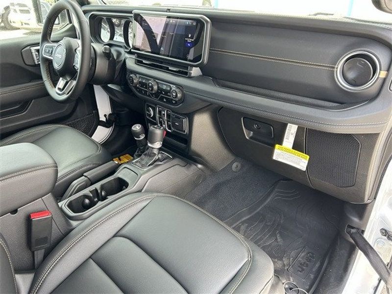 Jeep Wrangler 4xE Sahara in a Bright White Clear Coat exterior color and Blackinterior. McPeek