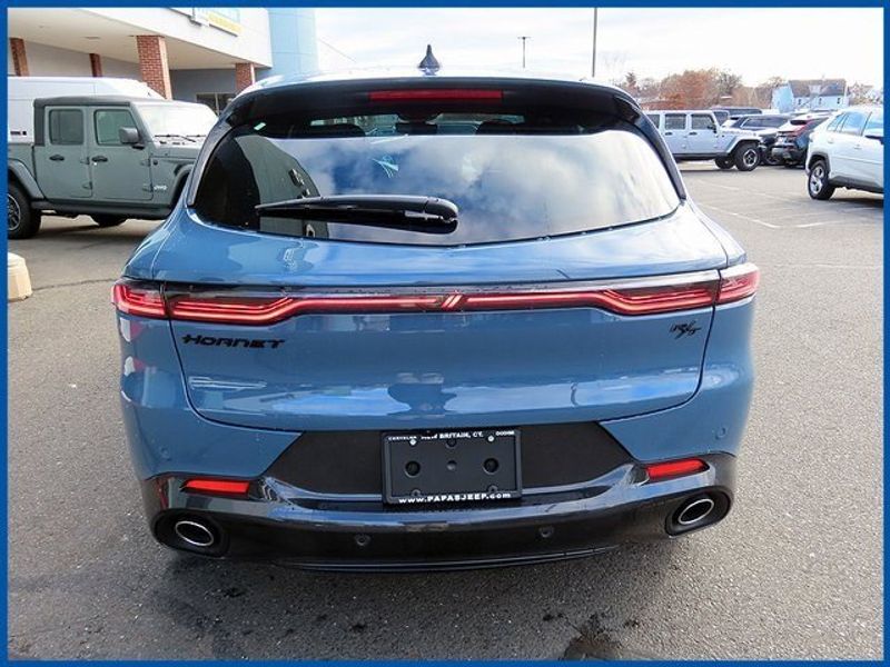 2024 Dodge Hornet R/T Plus in a Blue Steele exterior color and Blackinterior. Papas Jeep Ram In New Britain, CT 860-356-0523 papasjeepram.com 