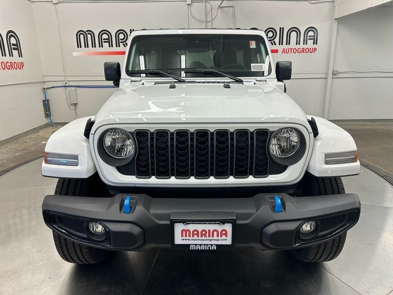 2024 Jeep Wrangler 4-door Sport S 4xe in a Bright White Clear Coat exterior color and Blackinterior. Marina Chrysler Dodge Jeep RAM (855) 616-8084 marinadodgeny.com 