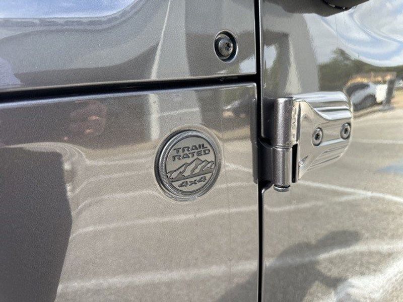 2023 Jeep Wrangler 4-door Sport Altitude 4x4 in a Granite Crystal Metallic Clear Coat exterior color and Blackinterior. Randall Dodge Chrysler Jeep 877-790-6380 randalldodgechryslerjeep.com 