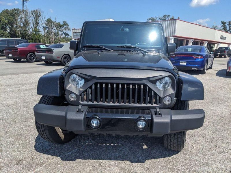 2017 Jeep Wrangler Unlimited Sahara in a Black Clear Coat exterior color and Blackinterior. Johnson Dodge 601-693-6343 pixelmotiondemo.com 