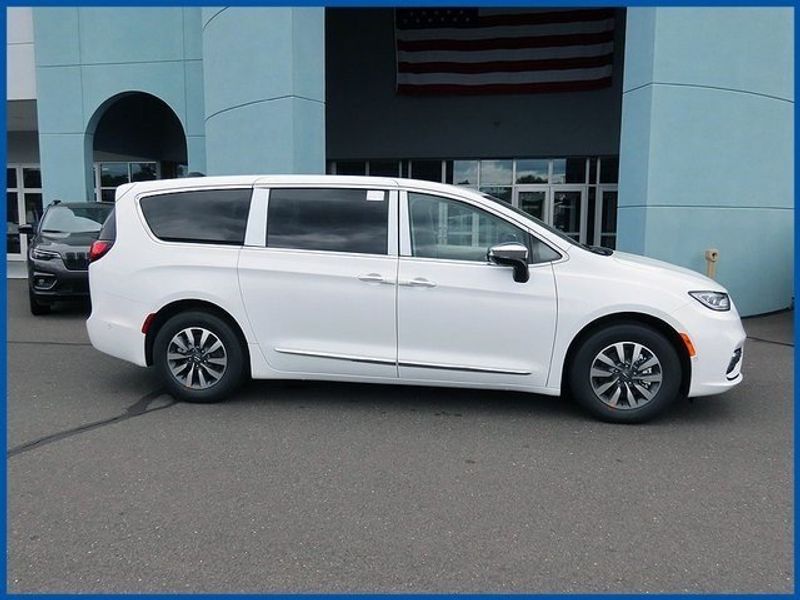 2023 Chrysler Pacifica Hybrid Limited in a Bright White Clear Coat exterior color and Black/Alloy/Blackinterior. Papas Jeep Ram In New Britain, CT 860-356-0523 papasjeepram.com 